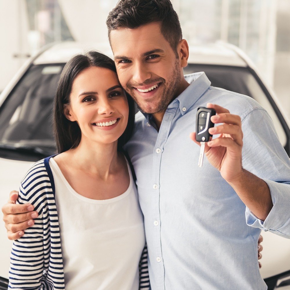 Young couple buying a new car